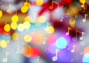 music notes on blurred lights background. christmas and new year 2018 celebration