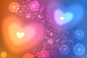 abstract colorful defocused, blurred heart shaped bokeh lights effect texture, background. universal wallpaper to valentine's day with blue, pink, yellow hearts. love, passion, feelings concept.